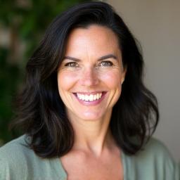 Professional headshot of Dr. Elara Vance, smiling warmly.